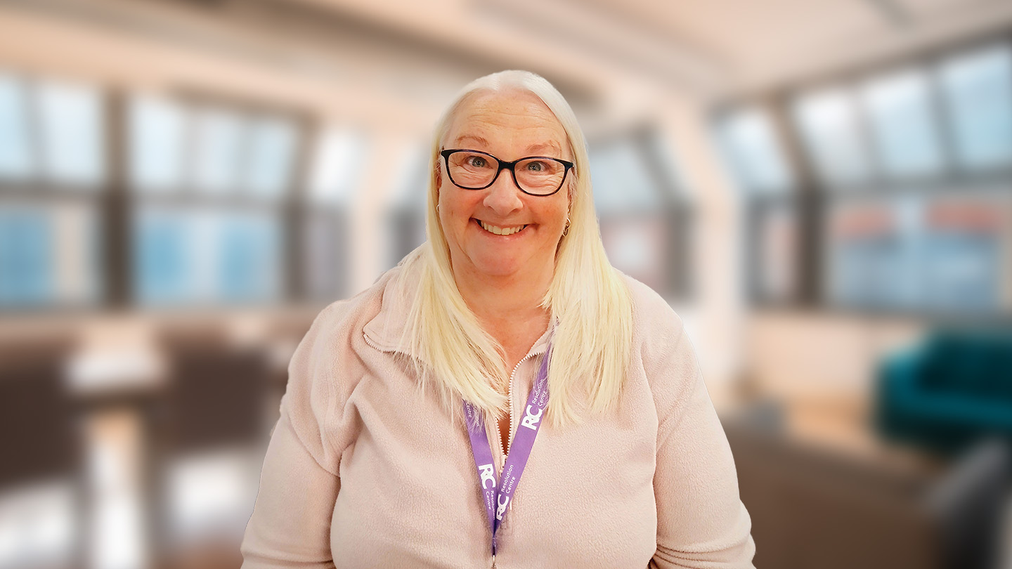 Photo of Ginny, a Customer Service Officer, working in the Resolution Centre at the Home Office.